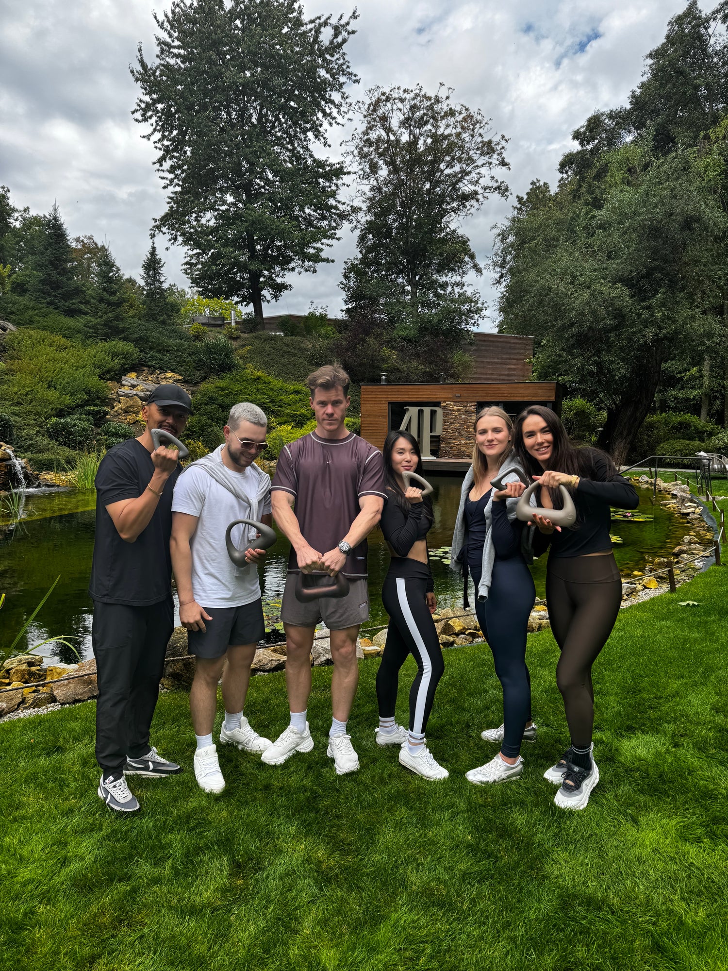 Community of people with healthy wellness lifestyle habits and ATOMYA design kettlebells and dumbbells