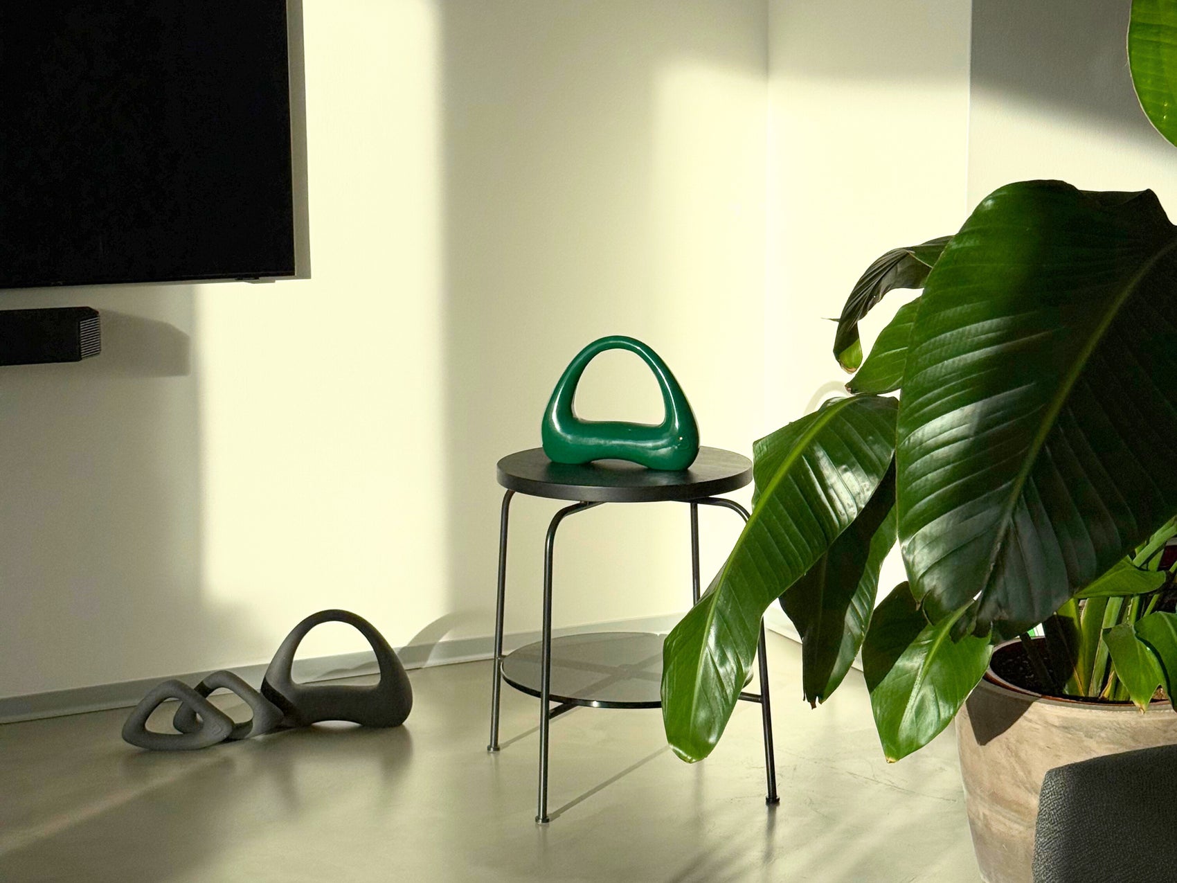 collection of atomya kettlebells and dumbbells green and grey
